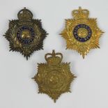 Three Royal Marines shako plates of which two have cobalt blue enamel decoration,