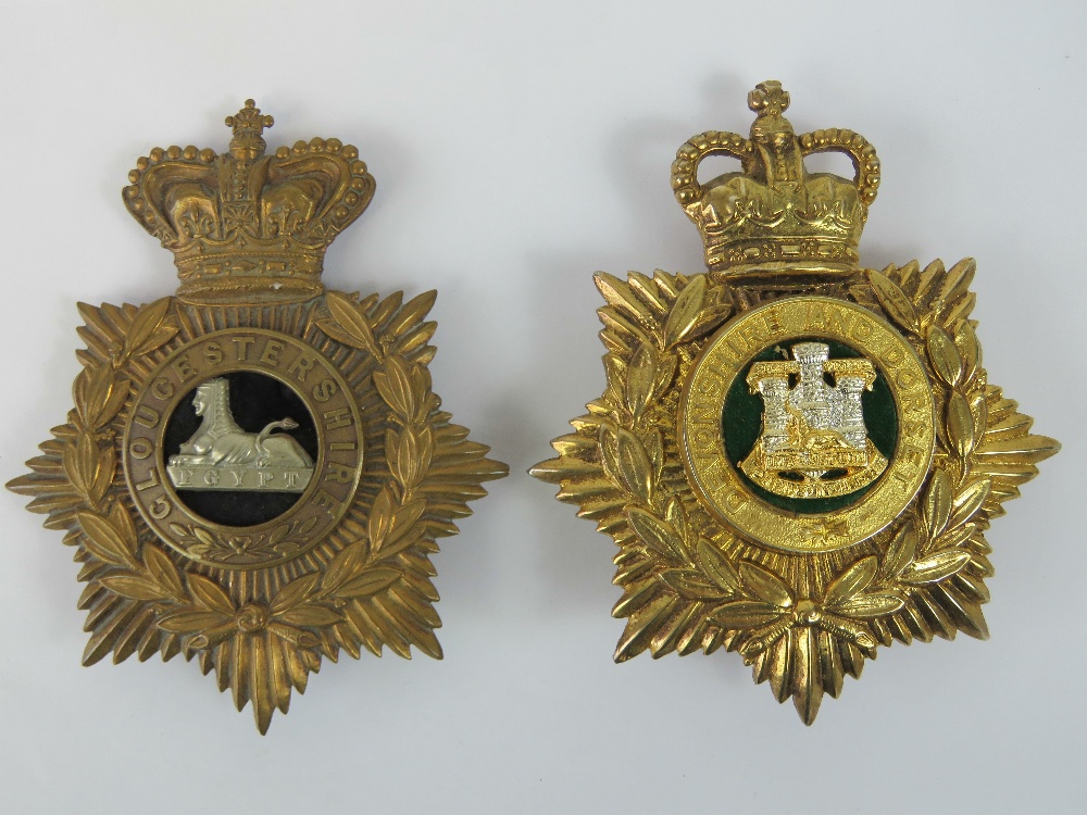 Two embossed regimental shako helmet plates each with crown over and being for Gloucestershire