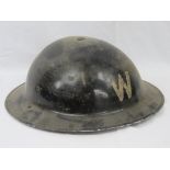 A WWII tin Wardens helmet having leather