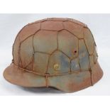 A WWII German Luftwaffe helmet with camo