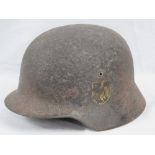 A WWII German Wehrmacht issue helmet in