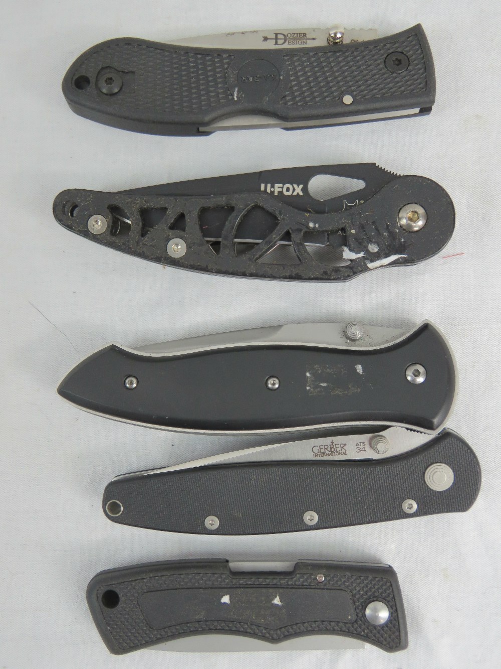 Five lock knives including; Gerber, CRKT