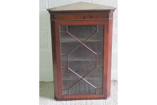 A astral glazed hanging corner cabinet,