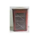 A astral glazed hanging corner cabinet,