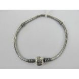 A silver Pandora charm bracelet having 9