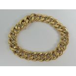 An 18ct gold curb link bracelet having tongue clasp stamped 750,