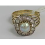 A vintage diamond and pearl cluster ring, central split pearl measuring 6.