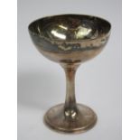 A HM silver communion cup standing 8cm high of plain single footed form, hallmarked Birmingham 1932,