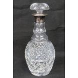 A HM silver and cut glass decanter complete with original stopper,