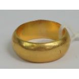 A heavy yellow metal wide D-shaped band, size S, 16.9g.