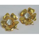 A rare and unusual pair of diamond floral collar or lapel brooches,