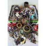 A large quantity of assorted modern and vintage costume jewellery including necklaces, bangles,