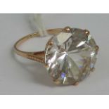 A 9ct rose gold and white topaz solitaire ring (approx measurements 16 x 16 x 10mm), stamped 9ct,