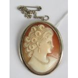 A Continental silver cameo brooch / pendant, the oval carved shell bearing female portrait,