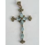 A silver cross pendant set with aquamarines and marcasites, measuring 6cm in length including bale,