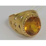 An 18ct gold pierced ring having central oval citrine measuring, stamped 750, size L-M, 6.1g.