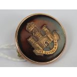 A WWI 9ct gold and 'tortoiseshell' regimental sweetheart brooch having inlaid emblem for the