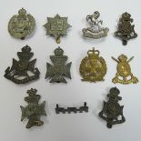 Eleven assorted London regiment badges including; County of London, The Rangers, Carabiniers, etc.