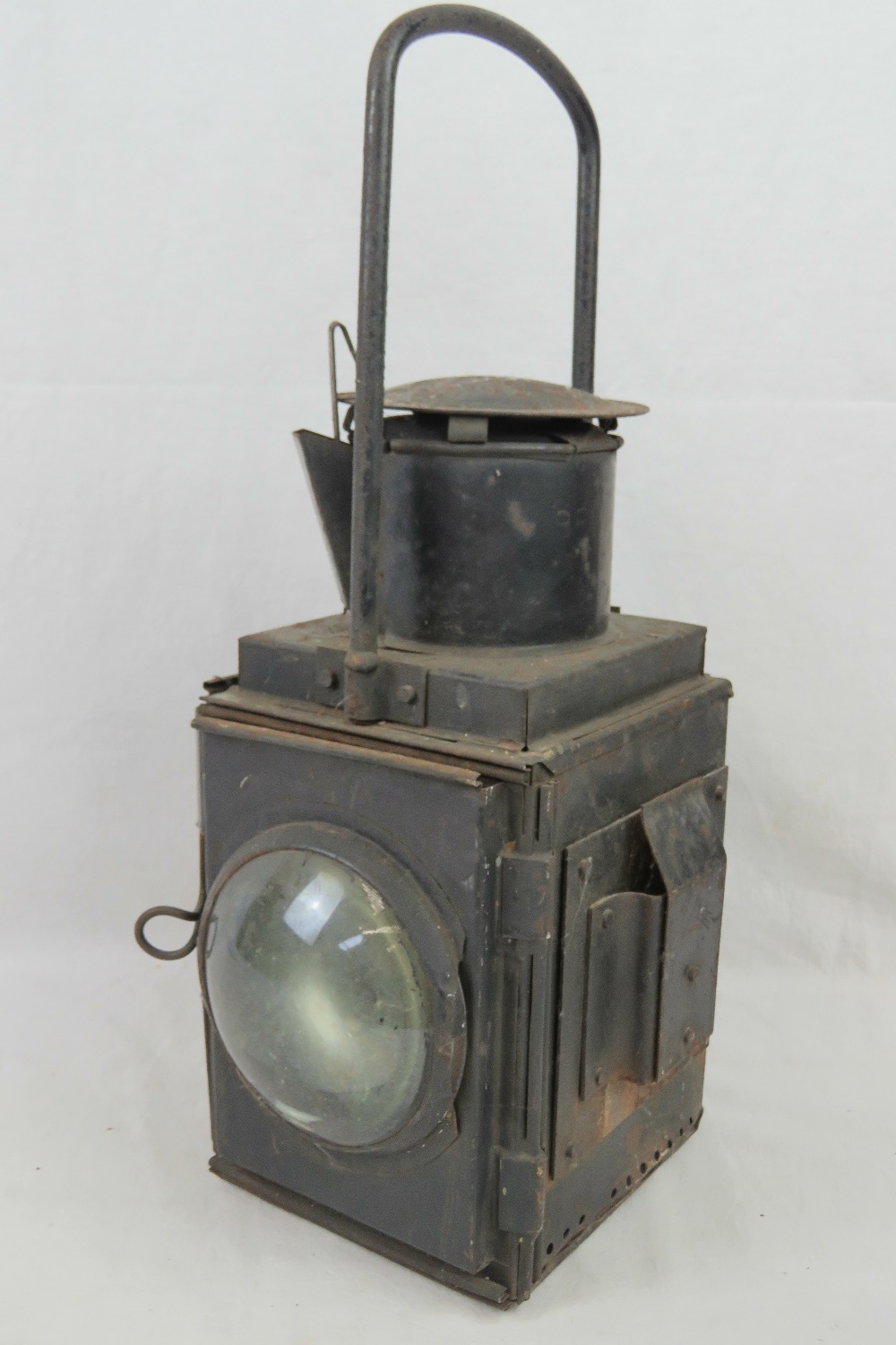 A vintage enclosed magnified gas lamp as used in military ammunition stores / cargo holds on ships/