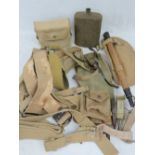 A quantity of assorted WWII British Military 37 pattern webbing including; trenching tools,