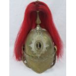 A Dragoon Guards 19th century brass helmet baring the number 1 to the shako plate,