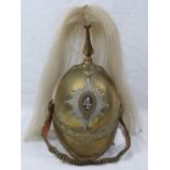 A Dragoon Guards 19th century brass helmet bearing the number 4 to the shako plate,