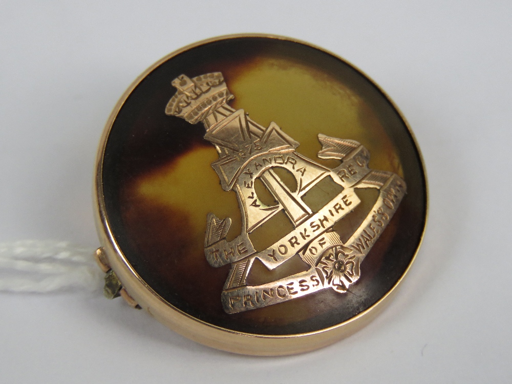 A WWI 9ct gold and 'tortoiseshell' regimental sweetheart brooch having inlaid emblem for the