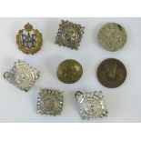 An enamelled RAF sweetheart brooch together with other vintage military buttons and badges.