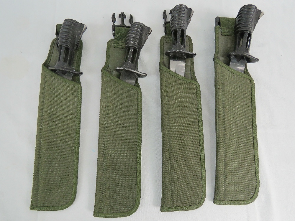 Four SA80 bayonets with canvas frogs.