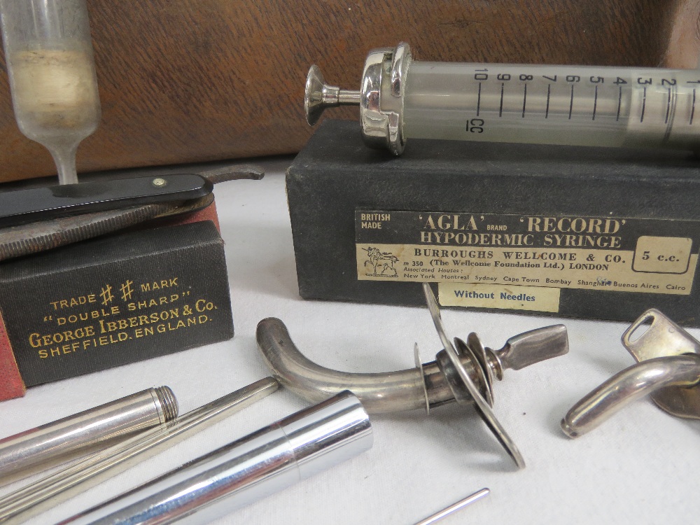 A leather doctors bag opening to reveal a quantity of vintage medical equipment within, - Image 2 of 2