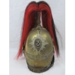 A Dragoon Guards 19th century brass helmet bearing the number 3 to the shako plate,