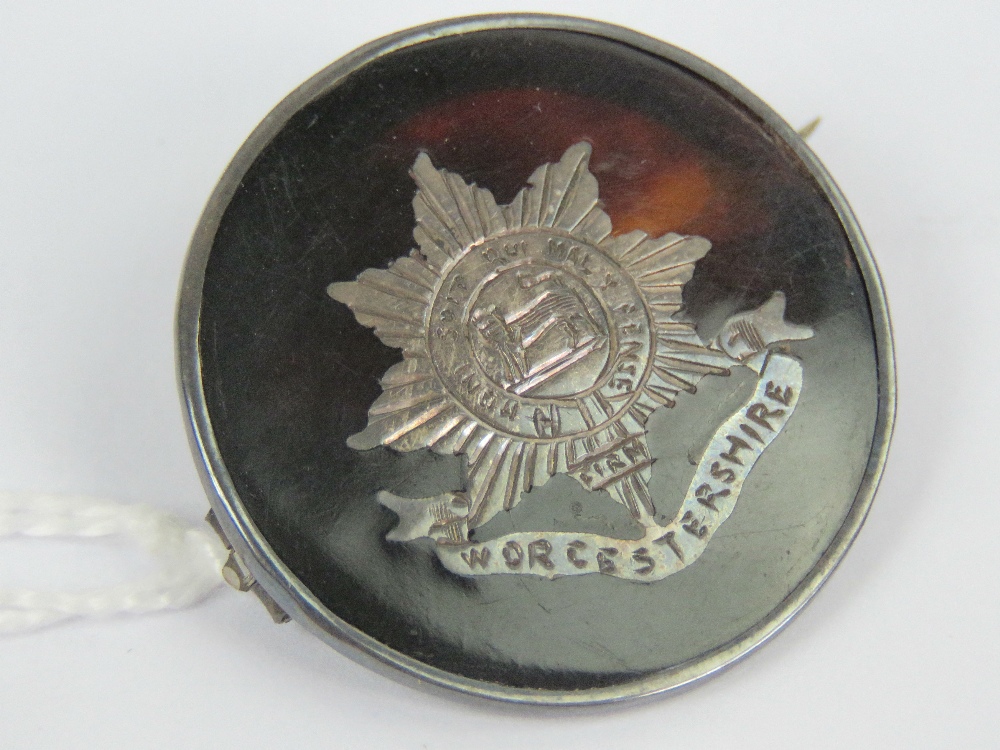 A WWI HM silver and 'tortoiseshell' regimental sweetheart brooch having inlaid emblem for the