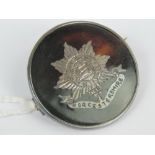 A WWI HM silver and 'tortoiseshell' regimental sweetheart brooch having inlaid emblem for the