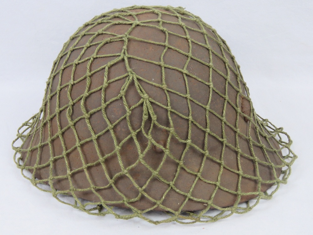 A WWII Japanese Infantry issue helmet wi