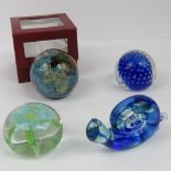 A modern globe paperweight set with geol