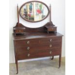 An Edwardian dressing chest having oval