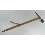 A vintage climbing axe complete with can