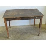 An early 20th century pine table raised