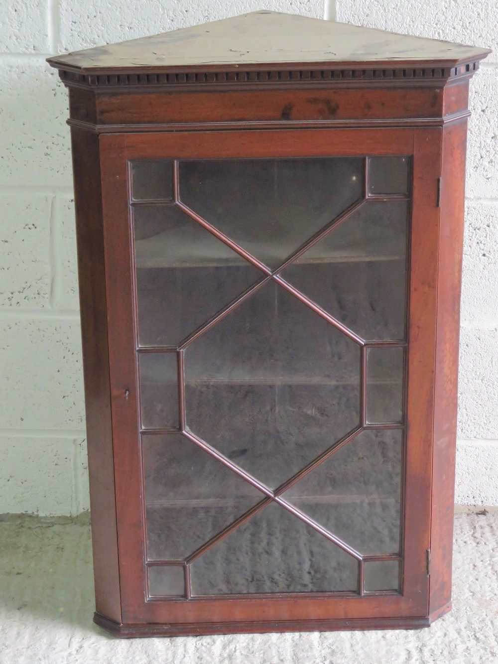 A astral glazed hanging corner cabinet,