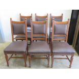 A fine set of six oak dining chairs all