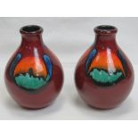 A pair of Poole Pottery red ground short