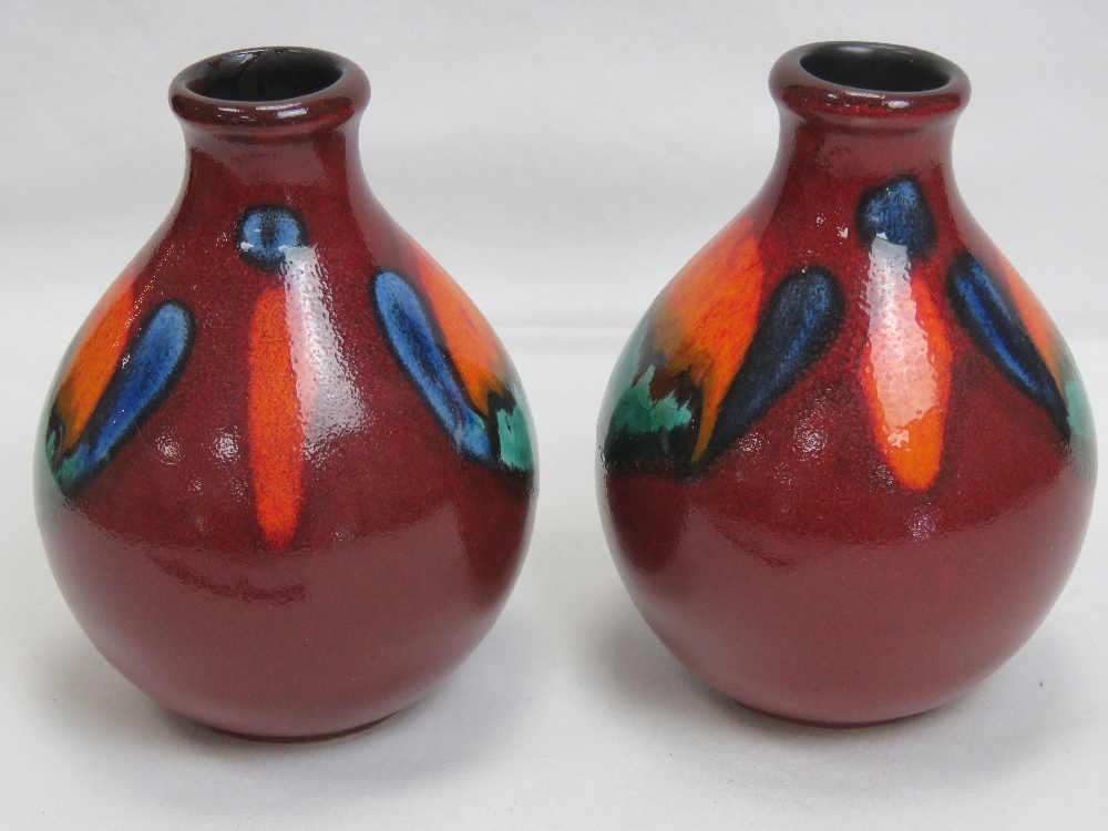 A pair of Poole Pottery red ground short - Image 2 of 3