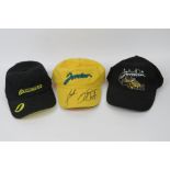 Three Jordan GP Racing caps, one signed by Jarno Trulli and Heinz Harald Frentzen.