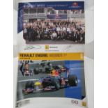 Two Red Bull racing posters, one signed by Mark Webber and David Couthard, 31 x 40cm.