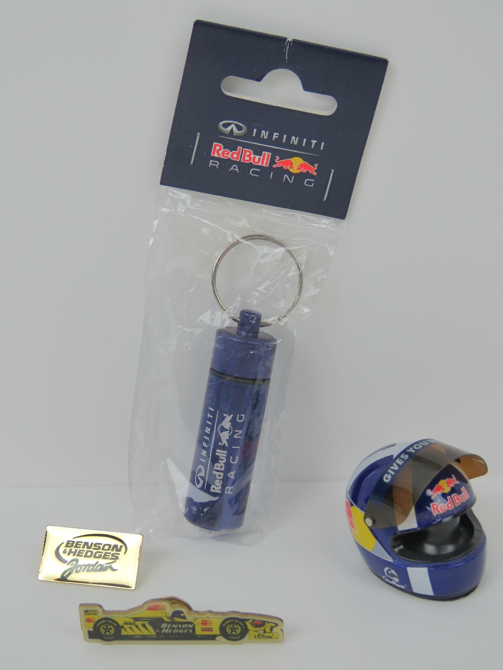 A David Coulthard mini helmet unboxed, together with some Red Bull Racing ear plugs,