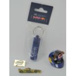 A David Coulthard mini helmet unboxed, together with some Red Bull Racing ear plugs,