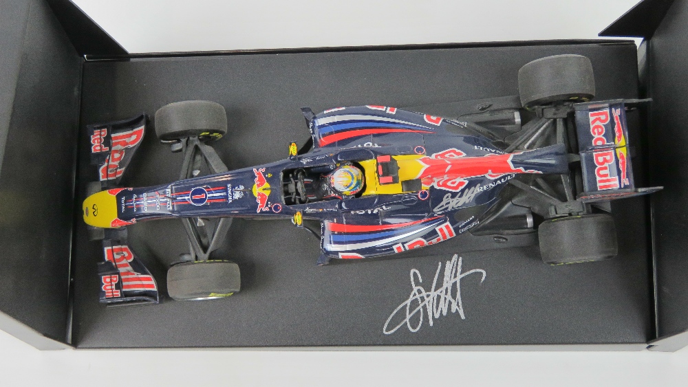 A 1:18 scale Red Bull racing F1 car signed by Sebastian Vettel 2001 25.5cm in length on base. - Image 2 of 2