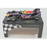 A 1:18 scale Minichamps Red Bull racing F1 car 2011 signed by Mark Webber, within original box.
