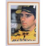 A large framed Damon Hill portrait bearing signature dated 1999, 70 x 49cm.