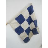 A vintage short handled square shaped checkered flag, 57 x 60cm.